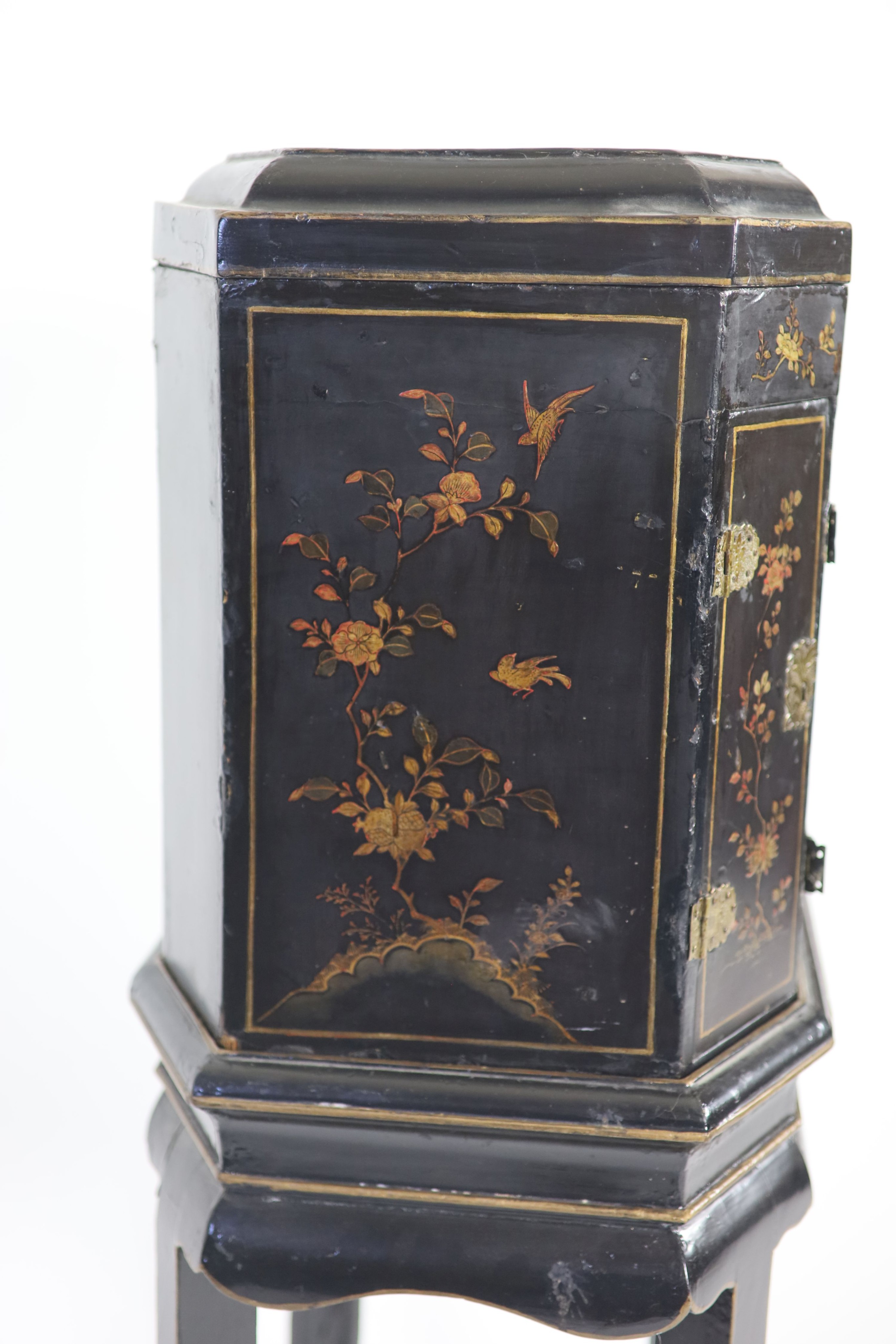 An 18th century Japanese black lacquered table cabinet on stand H 123cm. W 56cm. D 38cm.